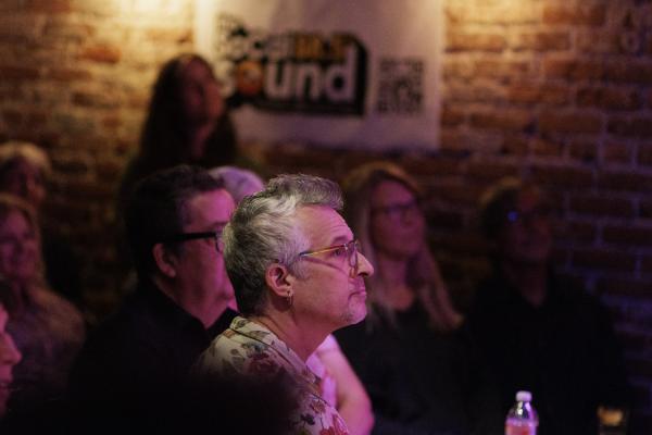 AUDIENCE MEMBER WATCHING WOMAN CRUSH WEDNESDAY BY THE SOCAL SOUND AT HOTEL CAFE